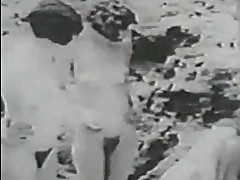 1928 vintage with a guy spying girls on the beach
